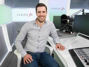 Alexander Dragonetti sitting at a radio desk