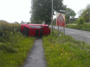 Supporting image for story: Car flips on to side after hitting speed warning sign