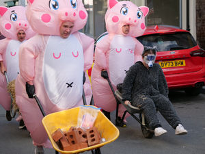 Supporting image for story: Baywatch, three pink pigs, a baby and bananas – Presteigne’s scorching wheelbarrow race night had it all