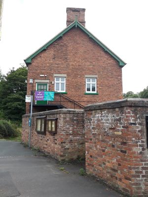 The alcove, near the corner of Wellington Road and Darby Road, Coalbrookdale, housed a phone box.