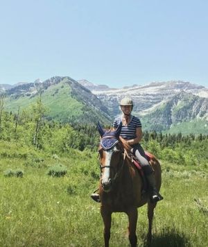 Angela horseriding in the mountains