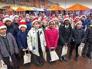 Supporting image for story: School children sing carols at Bilston and Wolverhampton outdoor markets - with pictures