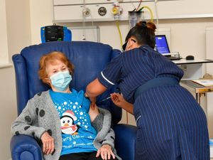 Supporting image for story: Charity T-shirt worn by first Covid vaccine patient receives big sales boost