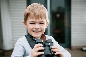 Activities to mark the Big Garden Birdwatch. Taking place here at Shropshire Hills Discovery Centre in Craven Arms. In Picture: George Turner, 3, looking for birds through his binoculars..