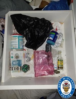 Inside the property police found more than 60 wraps of suspected crack, cocaine, and heroin, as well as around £2,000 in cash and a machete. (Photo: West Midlands Police)