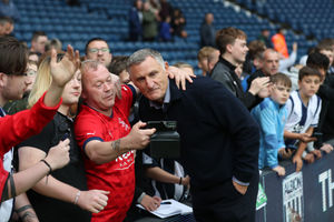 Mowbray posing for photographs with West Brom fans after the Clash of the Legends game in 2022 (Photo by Adam Fradgley/West Bromwich Albion FC via Getty Images)