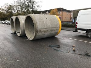 Three concrete cylinders in the road