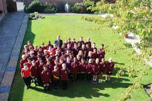 Headteacher, Mr Biggins, with Year 7 pupils from local primary schools