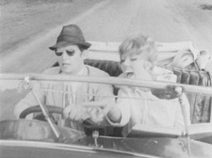 Marilyn Gates, played by Sue Nicholls, hits the road in a sports car in one of her adventures