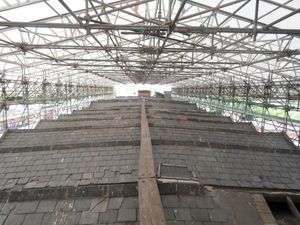 The roof of the main mill before work began shrouded in scaffolding