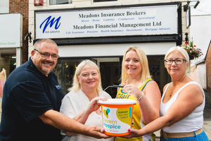 Marathon runner Clair Hatton and Meadons Insurance Brokers manager Lesley Prior (centre) with Paul and Debbie Higgins of P.S Higgins Electrical Services. Photo by Malcolm Hart