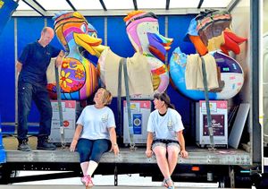 Julie Ward chats to Wes Treacy, from Cowan Haulage, as the ducks are moved. On the right is artist Nicky Meechan.