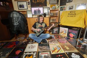 Ozzy Osbourne superfan Stephen Knowles in his living room dedicated to Black Sabbath memorabilia at home in Dudley, West Midlands.