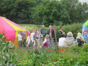 General scene of Yurt Maze event with bouncy castle on right and Yurt Maze on left.