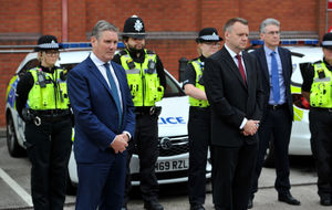 Sir Keir Starmer joins officers observing a minute's silence for the victims of the Plymouth shooting 