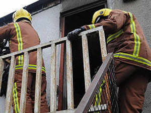 Supporting image for story: Woman saved as blaze hits flat