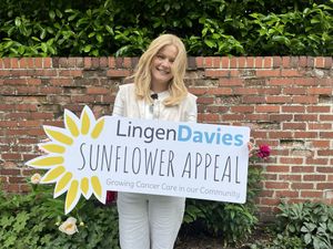 Sophie with the Sunflower Appeal sign 