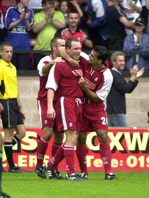 Roberto Martinez congratulates Darren Wrack on the winning goal against Nottingham Forest.