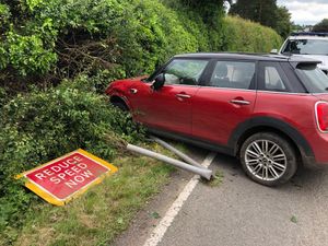 Supporting image for story: Suspected drink driver crashes Mini into 'slow down' sign