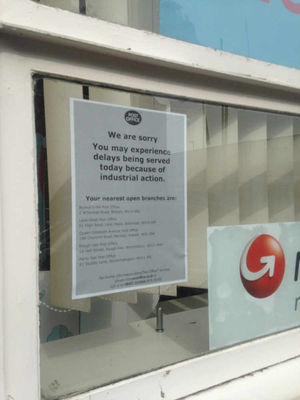 A sign outside the Willenhall branch tells customers to expect delays