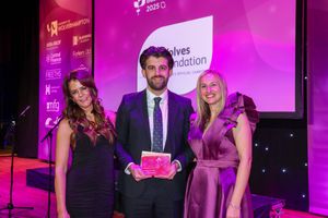 Wolves Foundation's Head of Programmes for Education, Employability and Youth Engagement Jonathan Warburton picks up the Business in Schools award.