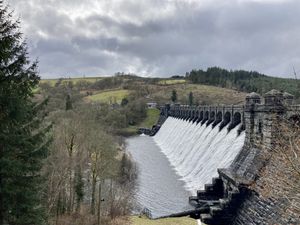 Supporting image for story: Water is once again flowing over Lake Vrynwy's dam as reservoirs are topped up by torrential rain and snow melt