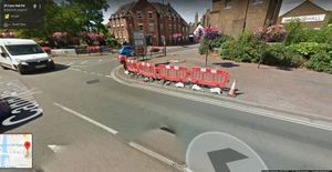 A Google Street View image captured in July 2018 shows the barriers in place