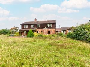 The property comes with around six acres of land. Photo: Zoopla/Harwood