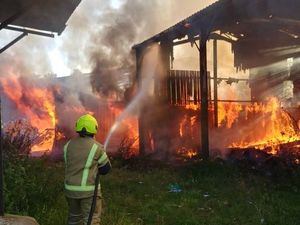 Supporting image for story: Firefighters tackle blazing buildings at Aldridge farm