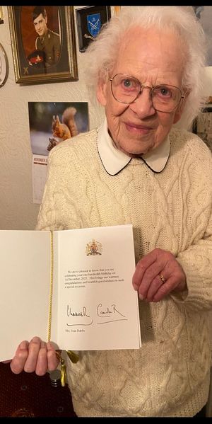 Joan Dabbs holds the card she received for her 100th birthday from the King. 