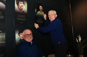 Richard Green and John Richards hang Diogo Jota's portrait in the Wolves Hall of Fame