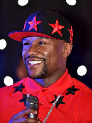 Laughing all the way to the bank - Floyd Mayweather has earned mega money since targeting Naseem Hamed.