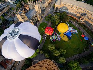Supporting image for story: Hot air balloons take to city skies to launch annual fiesta