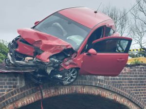 Supporting image for story: Passenger reportedly jumped into canal to escape car dangling off bridge