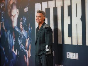 Supporting image for story: Robbie Williams surprises fans with early release of new album Britpop