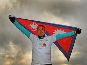 Supporting image for story: Shopkeeper Shayne reaches up to the clouds running height of Everest every day for Nepal charity