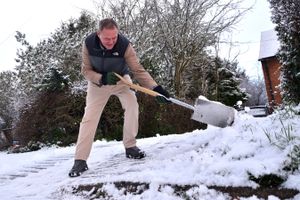 Wrockwardine resident Gareth Howell clears snow from his driveway during snowfall in Wrockwardine on Sunday, January 4, 2026. Photo: Mike Sheridan