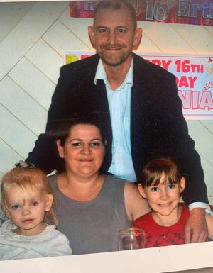 Mike Darlington with wife Nicola and daughters Elsa-May, five, and Karna-Rose, 10