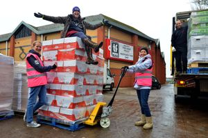 Telford Food Share Manager Lea Beven along with managers: Clare Watt and Diane Levitt. On the wagon is Geoff Hipkiss from Blakemores who were donating the food pictured