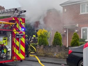 Supporting image for story: Dramatic moment firefighters in full breathing apparatus tackle house fire in West Bromwich