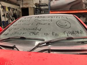 Supporting image for story: Police write message to machete robbers on windscreen of stolen car