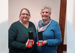 Anne Beckwith and Janet Burton who are among those issued with long service medals for 15 years of volunteering with the Royal Voluntary Service Newport Helpline