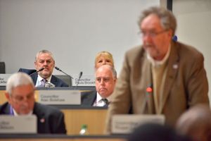 Councillor Ian Brookfield looks on as Roger Lawrence revealed he was stepping down as council leader