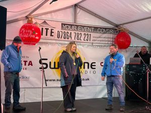 Lark Atkin-Davies on stage with Sunshine Radio before Christmas Lights Switch-on