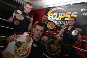 Champion of champions - Kyle Williams with (from back left) Jack Wiles, trainer Fran Zuccala and Katie Healy as they show off their belts.