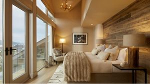A bed with a stunning view of the Lake District