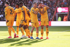 Matheus Cunha of Wolverhampton Wanderers celebrates after scoring his team's first goal by signalling the letter 'J' to show support to a young Wolves fan (Photo by Naomi Baker/Getty Images)
