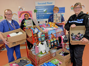 Supporting image for story: Hero police officer helps arrange donations for hospitals and hospices
