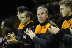 Kenny Jackett joins in the pre-match minute's applause for Roy Swinbourne and Sir Jack Hayward