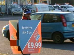 Supporting image for story: Letter: Horrified by Domino's Pizza human advert boards